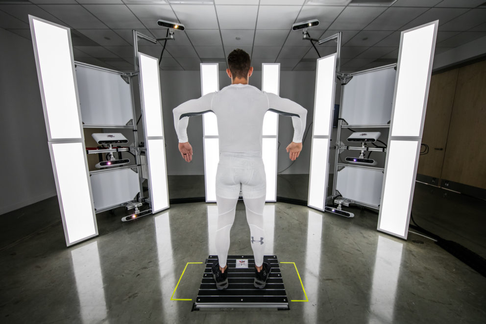 Man wearing white UA compression getting scanned